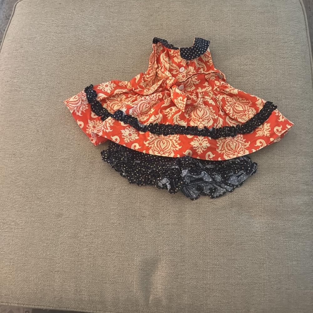 Blue and orange pernickety top and bottom set.